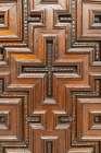 Cordoba, Andalusia, Spain. Carved wooden door in the Cordoba Cathedral, a former Moorish mosque. Art Print